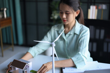 Beautiful engineer working in office design eco friendly and sustainable living home.