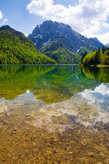 A magnificent landscape of Lake Del Predil (lago Del Predil) in Italy. Beautiful alpine lake, surrounded by Julian Alps. 