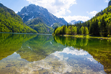 A magnificent landscape of Lake Del Predil (lago Del Predil) in Italy. Beautiful alpine lake, surrounded by Julian Alps. 