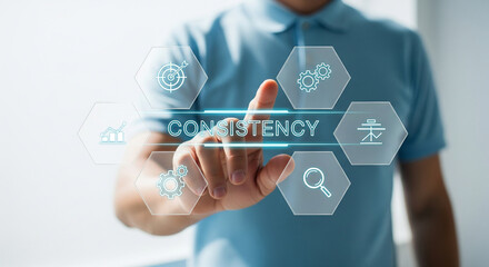 Person touching a digital interface displaying the word CONSISTENCY with surrounding icons
