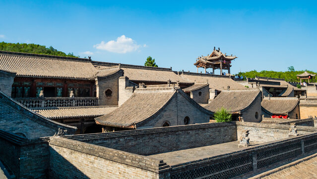 Impressive view of traditional chinese tiled roofs at the historic Wang Family Courtyard near Pingyao, Shanxi Province, China 
