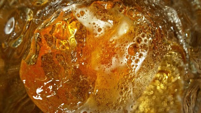 Super Slow Motion of Pouring Beer Inside Glass With Camera Motion Into Liquid at 1000fps.