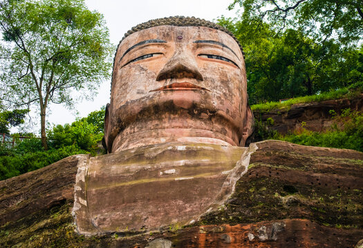 Stunning view of Leshan Giant Buddha, carved directly into the cliff face at the confluence of the Min, Dadu and Qingyi rivers, Sichuan, China