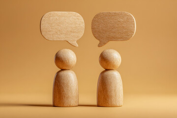 Two abstract wooden figures with speech bubbles representing communication and conversation on a warm monochromatic background in minimalistic style