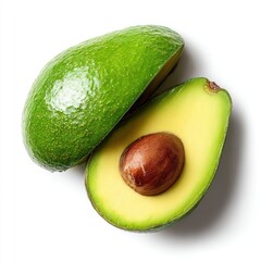 Sliced avocado, one with pit, showcases smooth green skin and yellow flesh, casting soft shadows on a white surface