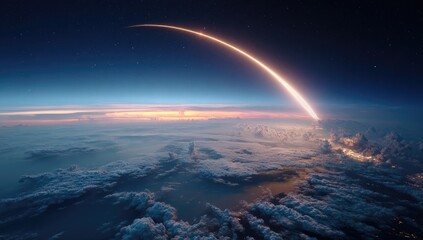 Arcing bright trail soars over Earth's curved horizon, above clouds, under a starlit sky during twilight