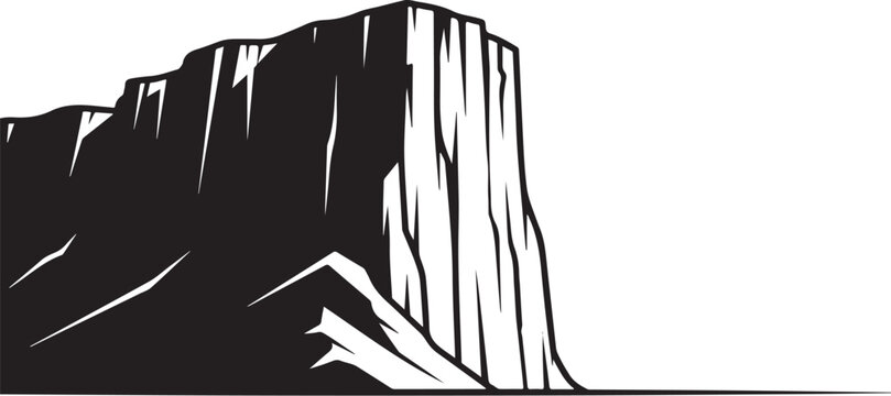 Black silhouette of a large vertical rock formation