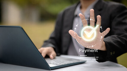Business person showing virtual check mark for secure online payment confirmation.