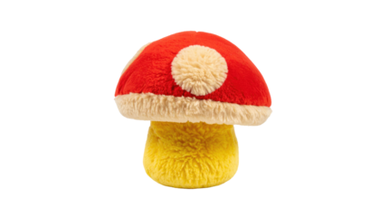 Plush mushroom with a red and white spotted cap and yellow stem against a black background