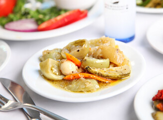 Mediterranean and Turkish meyhane cuisine with seafood, mezes, salads, grilled dishes, fresh fish, appetizers and desserts served in a modern restaurant setting.