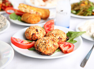 Mediterranean and Turkish meyhane cuisine with seafood, mezes, salads, grilled dishes, fresh fish, appetizers and desserts served in a modern restaurant setting.