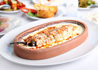 Mediterranean and Turkish meyhane cuisine with seafood, mezes, salads, grilled dishes, fresh fish, appetizers and desserts served in a modern restaurant setting.