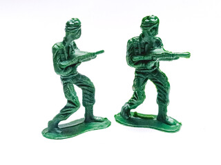 statue of a soldier, miniature toy soldiers on white background, close-up. Green toy soldiers isolated on a white background. Traditional figurines