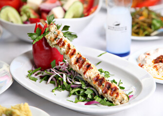 Mediterranean and Turkish meyhane cuisine with seafood, mezes, salads, grilled dishes, fresh fish, appetizers and desserts served in a modern restaurant setting.