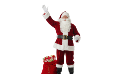 Happy Santa Claus standing in full traditional red suit waving hello with gift sack isolated on Transparent Background