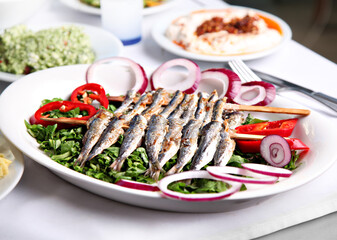 Mediterranean and Turkish meyhane cuisine with seafood, mezes, salads, grilled dishes, fresh fish, appetizers and desserts served in a modern restaurant setting.
