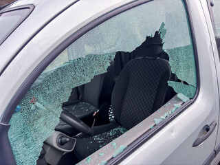 Car window smashed as a result of an act of vandalism