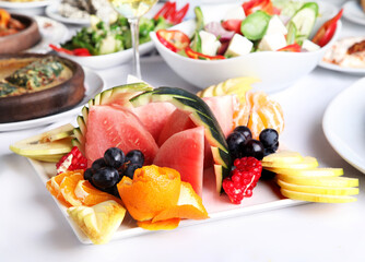 Mediterranean and Turkish meyhane cuisine with seafood, mezes, salads, grilled dishes, fresh fish, appetizers and desserts served in a modern restaurant setting.