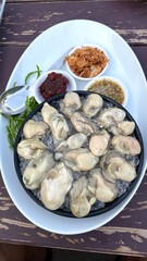 Fresh oysters seafood menu on the ice , in thai food restaurant.