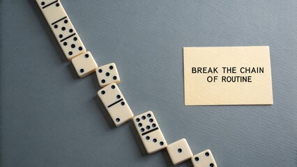 Domino line with a gap demonstrating breaking the cycle of routine