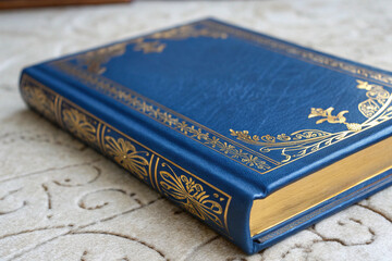  blue book with-gold-accents on-a-textured surface