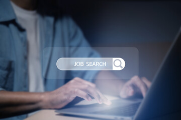 A man holding a smartphone and laptop is using a search engine to find job openings.