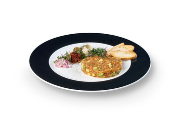 Salmon avocado tartare serving with capers and crostini