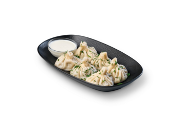 Khinkali dumplings with sour cream on plate transparent background