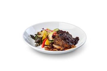 Braised beef shank with mixed green salad on plate