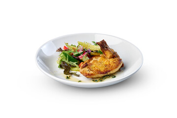 Plate of roasted chicken with fresh green salad