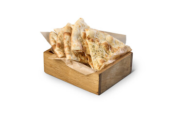 Slices of focaccia flatbread with herbs in a rustic wooden box
