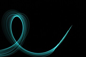 Long exposure light painting photography. Swirls of light against a black background