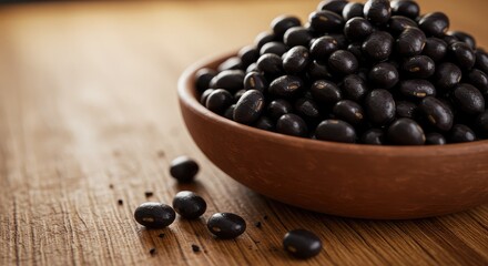 Enjoy a hearty bowl of nutritious black beans, perfect for healthy recipes and delicious vegan meals in a rustic wooden bowl on a textured wooden table