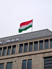 A Hungarian flag hangs on a rooftop in Berlin.