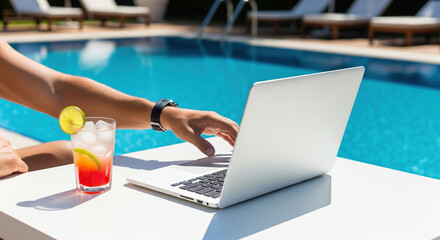 Obraz premium Person Working on Laptop by Pool with Refreshing Drink in Summer Setting