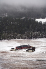 Foggy Early Winter Landscape with Traditional Red Farm Houses amidst Fields Near Trillemarka-Rollagsfjell Nature Reserve, Prestfoss, Norway