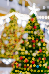 Abstract blurry bokeh Christmas within shopping mall defocused background