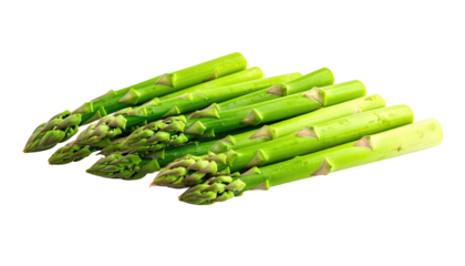 Pile of vibrant green asparagus spears stacked closely on a black background