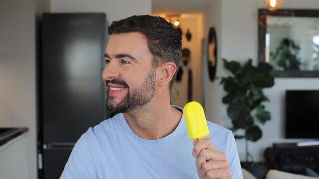 Comedic man eating a lemon popsicle