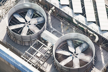 fans with metal blades on the roof of the cooling air conditioning system