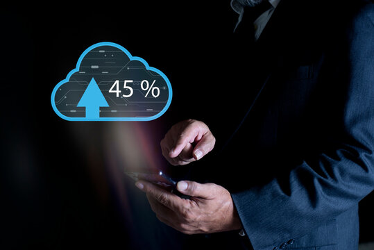 Businessman using smartphone with arrows and percent going up backing up data on cloud technology. Global cloud computing, digital interface and data processing concept - Powered by Adobe