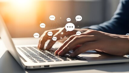 Hands typing on laptop with floating digital avatars above