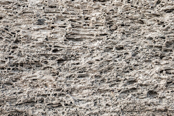 background of porous rock structure close-up