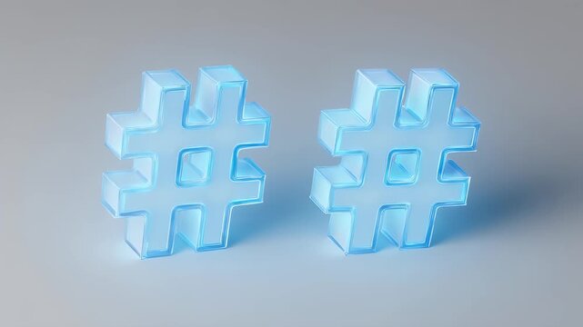 Two translucent, light blue hashtag symbols on a light gray surface, casting subtle shadows