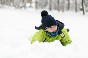 Little Boy Having Fun in the Snow