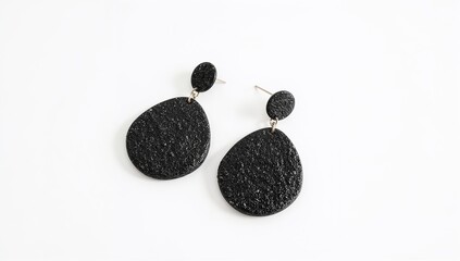 Lava stone earrings porous black natural volcanic textured boho design on plain white background