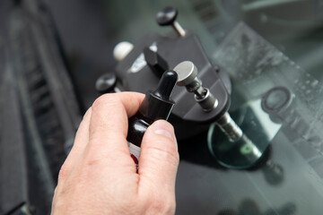 Repair of chips and cracks on car windows. Repair of windshields