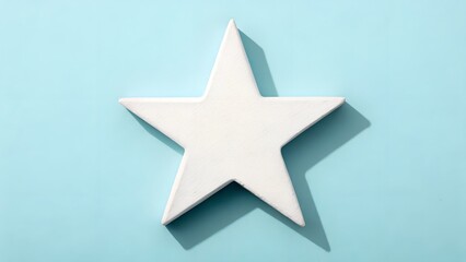 Obraz premium A Single White Star Shape Centered On A Soft Blue Background With Dramatic Shadows