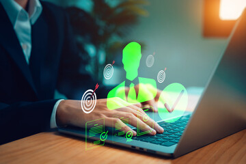 Digital productivity and target achievement concept with glowing icons above a laptop, illustrating business efficiency, goal setting, performance tracking, project management.
