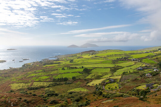 Panoramic high level view over the coastline of Kerry County, Ireland and the North Atlantic Ocean with in distance Scariff and Deenish islands